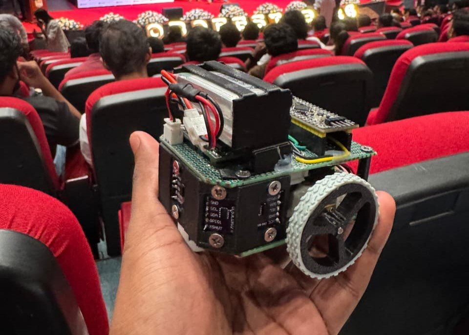 Botato micromouse held in a hand at ROBOFEST 2026